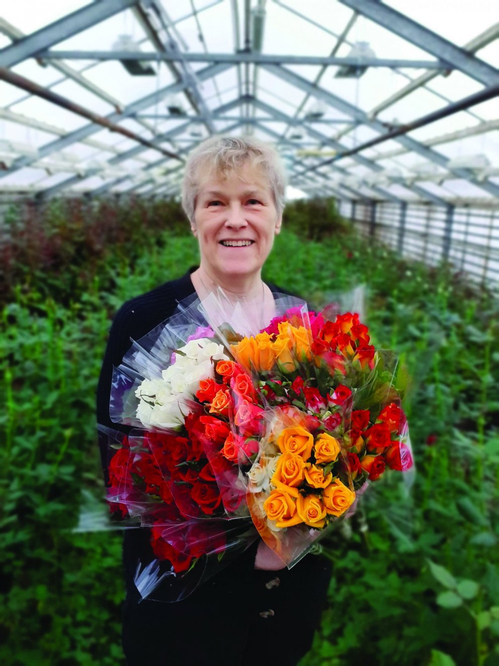 María í blómahafi.