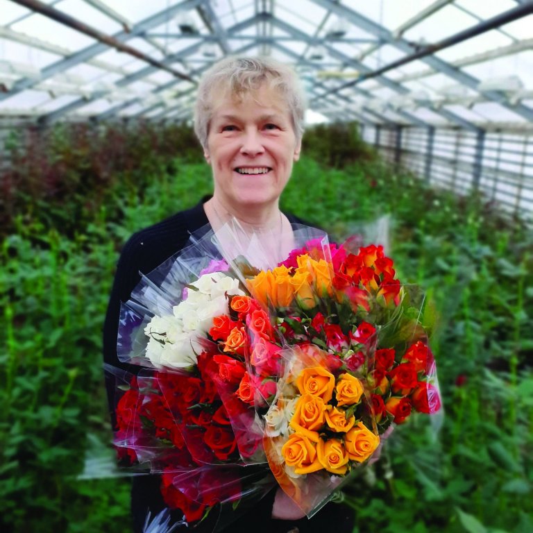 María í blómahafi.